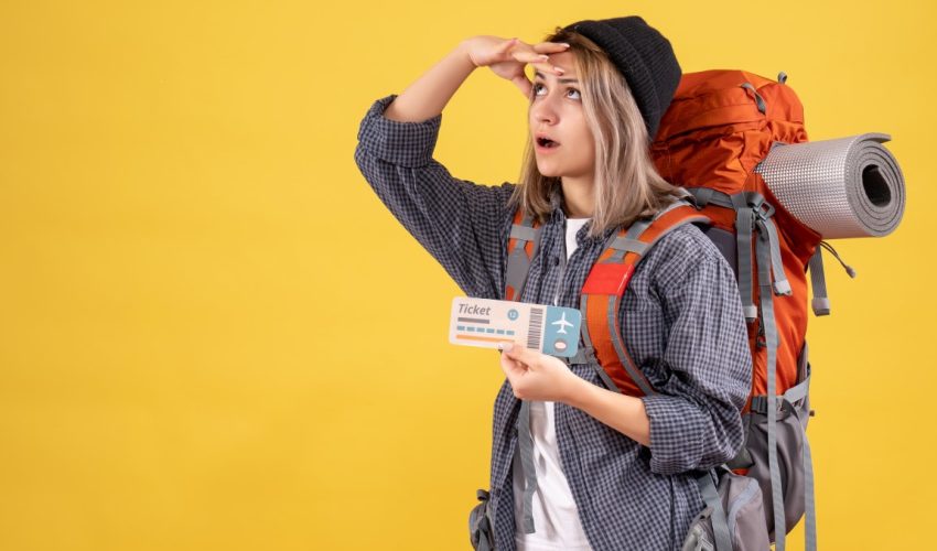 traveler-woman-with-backpack-holding-ticket-looking-up (Medium) traveler-woman-with-backpack-holding-ticket-looking-up (Medium)